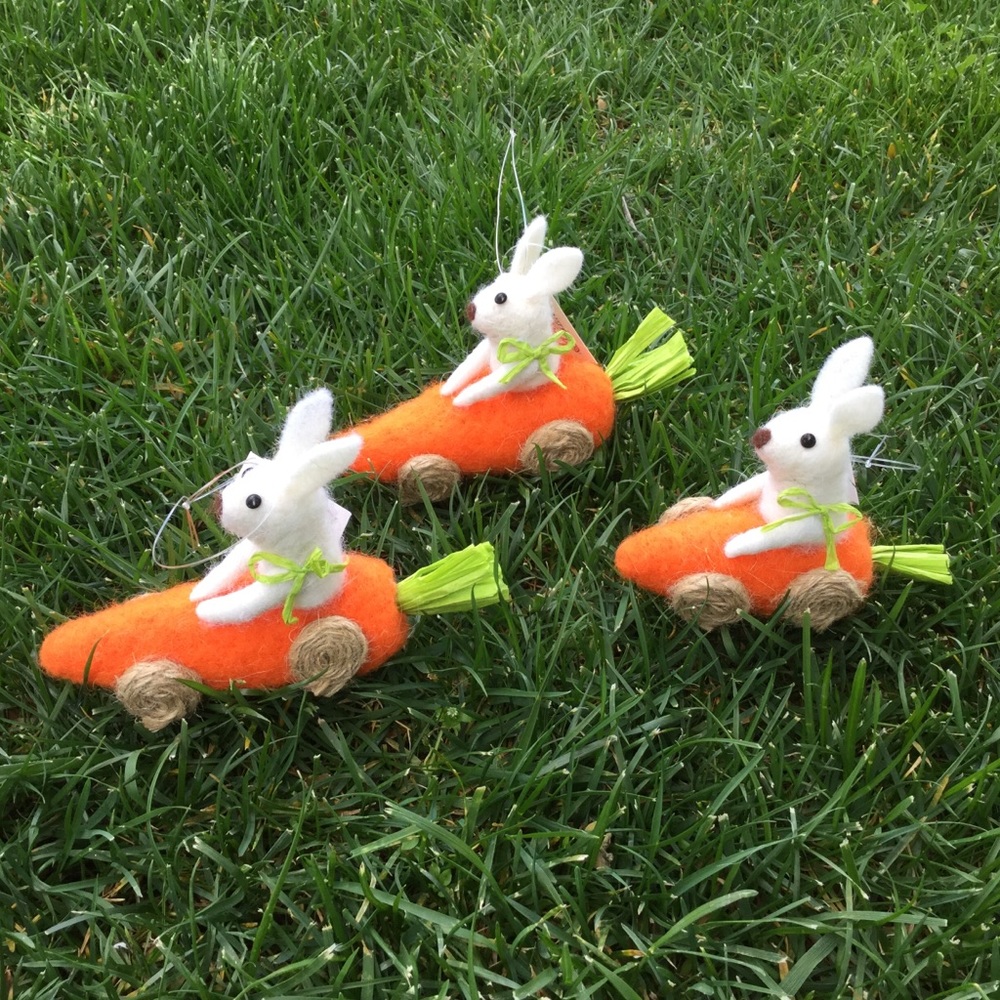 3 felted race car rabbits.